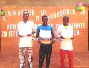 Ambroise, Hervé and Moïse with their diplomas.