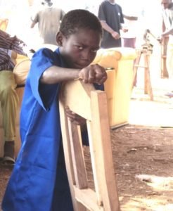 Hervé polishing a chair.