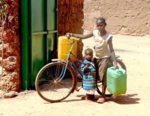 Coming back home, lugging two barrels, taking care of my little cousin